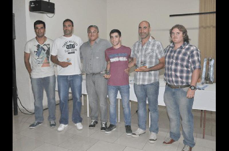 Mauricio Beltramella (segundo a la izquierda) logrÃ³ cinco campeonatos de divisiones formativas en 2014 junto a su equipo de trabajo 